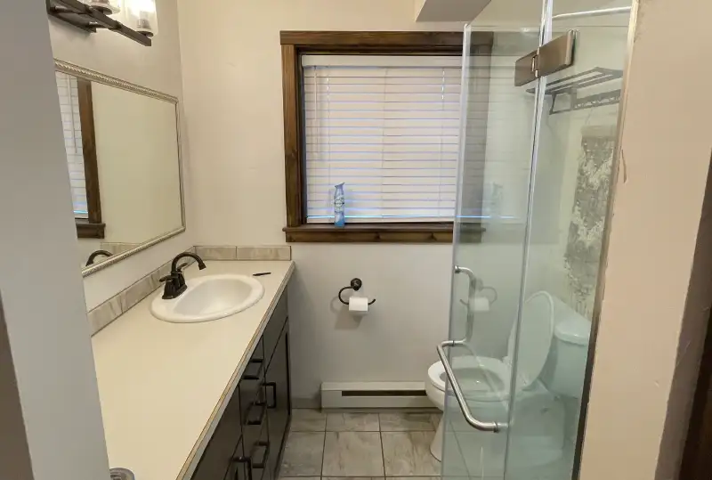 Built For Comfort Bathroom Glass Wall Cream with Dark Trim