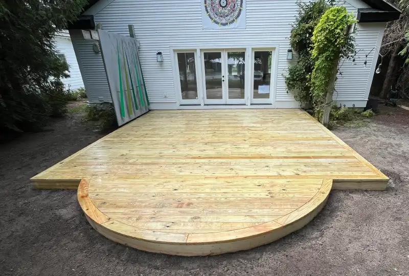 Expertly Executed Light Wood Arched End Walkout Deck