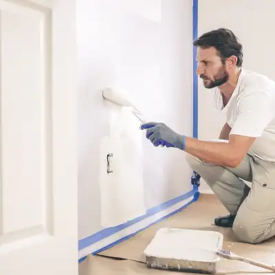 Photo Collage – Man Crouched Small Roller White Wall